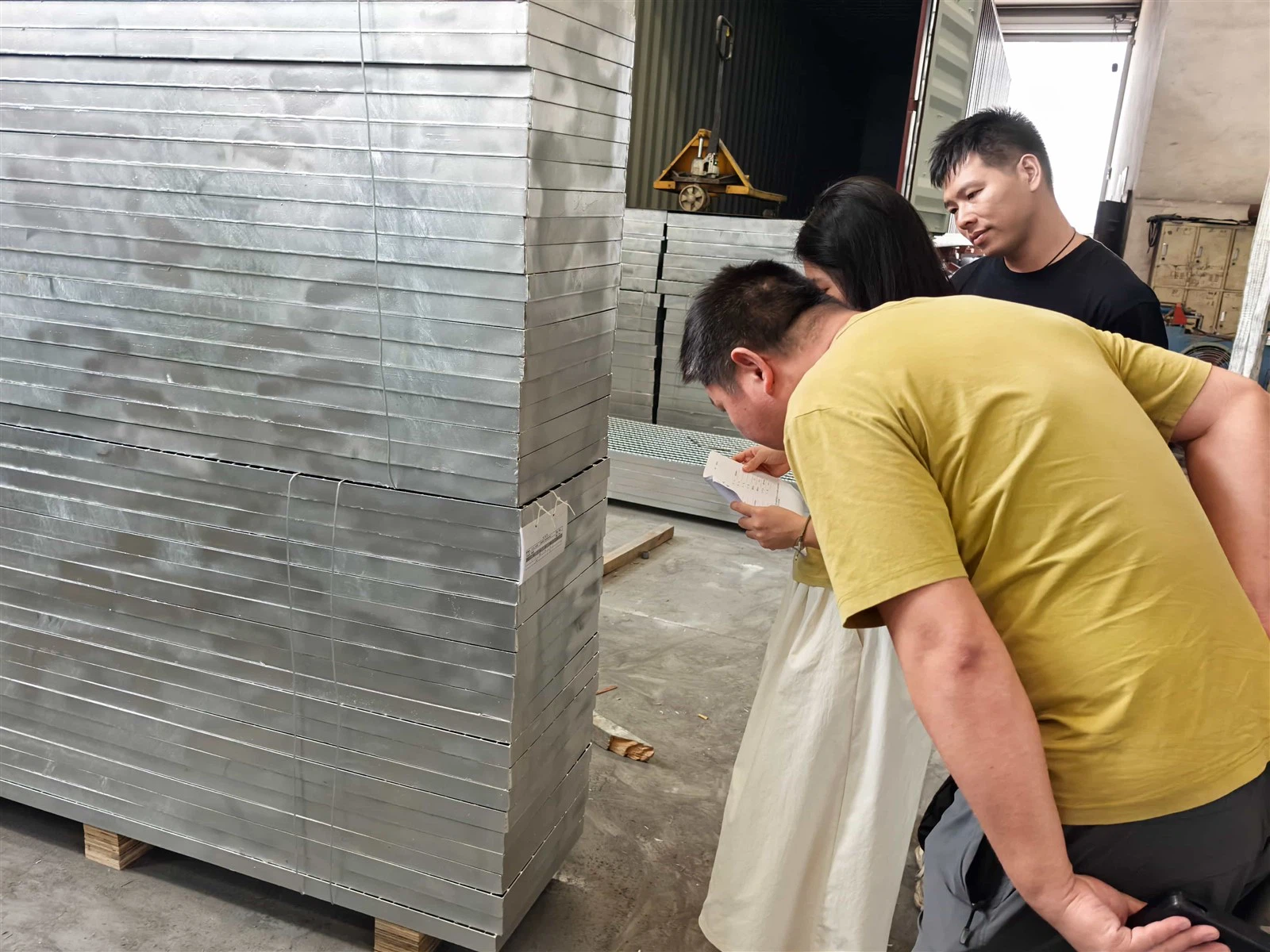 Quality inspection of galvanized steel grating panels before shipment in Preet Grating workshop Quality inspection of galvanized steel grating panels before shipment in Preet Grating workshop